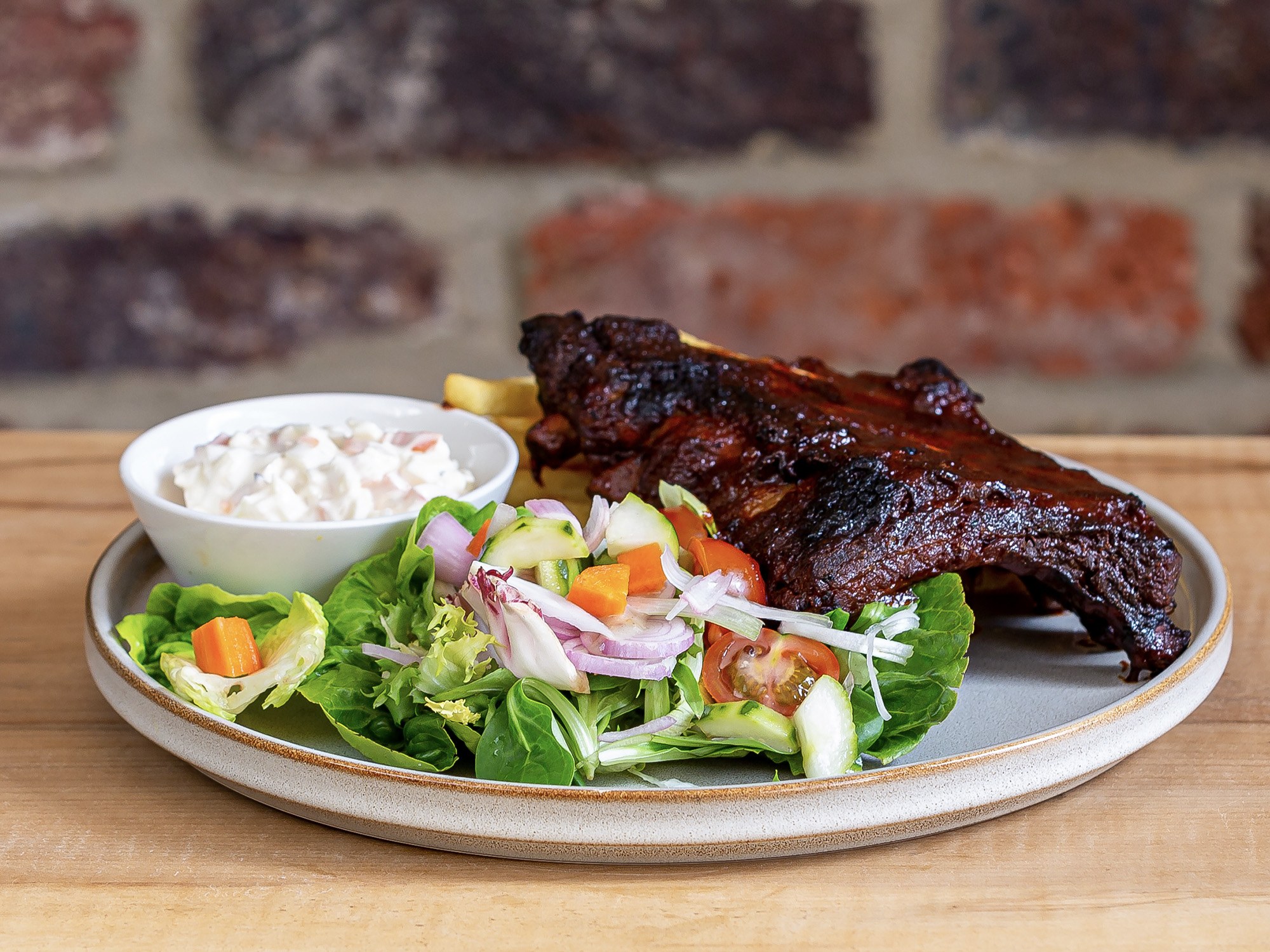 Barbecue ribs with salad and coleslaw